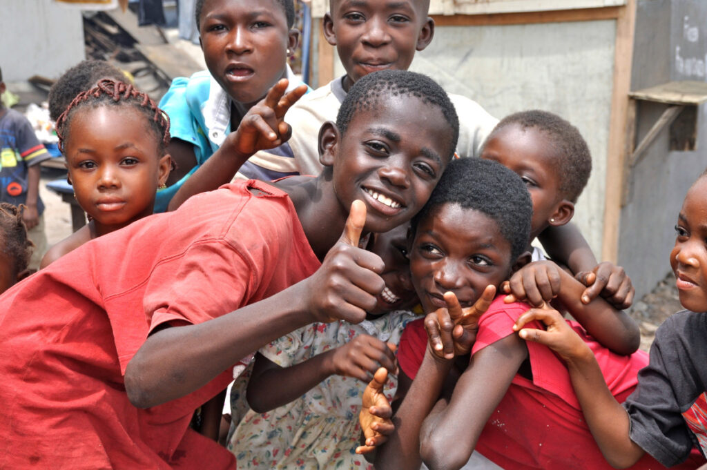 Image of group of 7 African children posing for the camera.